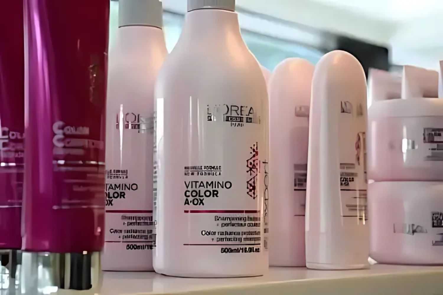 L'Oréal hair care products displayed on a shelf in a bright retail setting.
